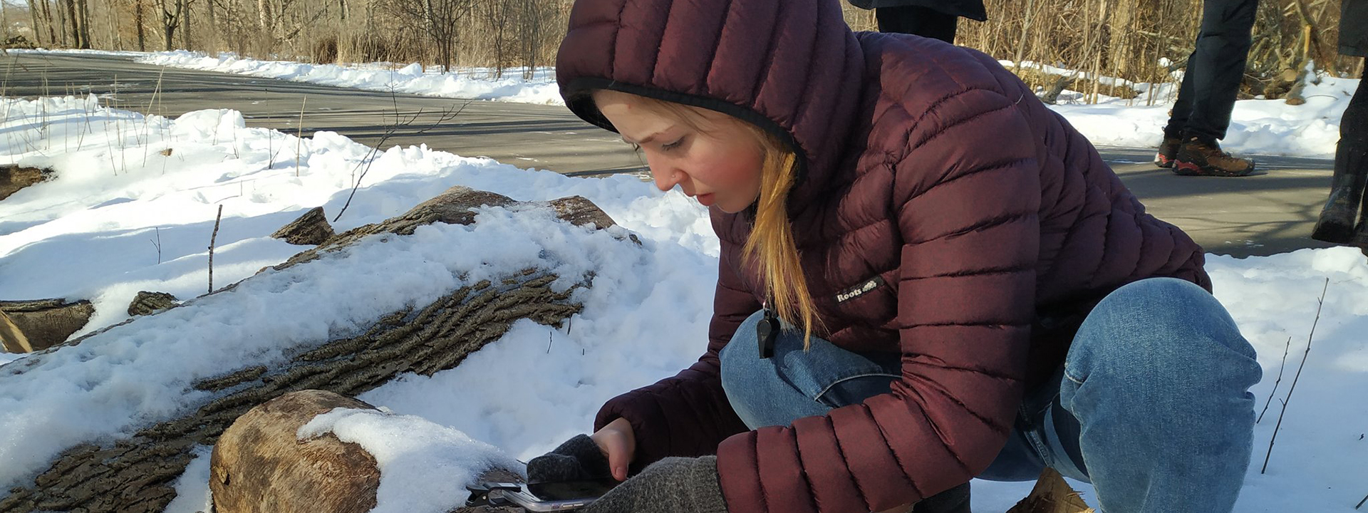 H3-ELP student examining a log